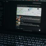 Laptop screen shows a map and related information.